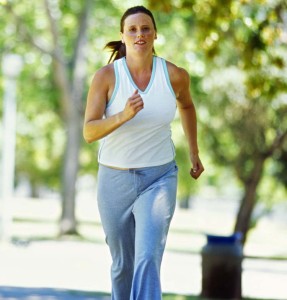 portrait of a mid adult woman jogging in a park