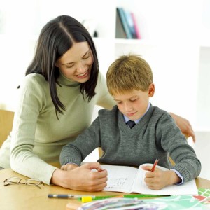 Young Boy Being Tutored by His Teacher